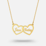 Two Hearts Necklace in gold with personalized engraving of names Tess and Bailey, representing love and bond.