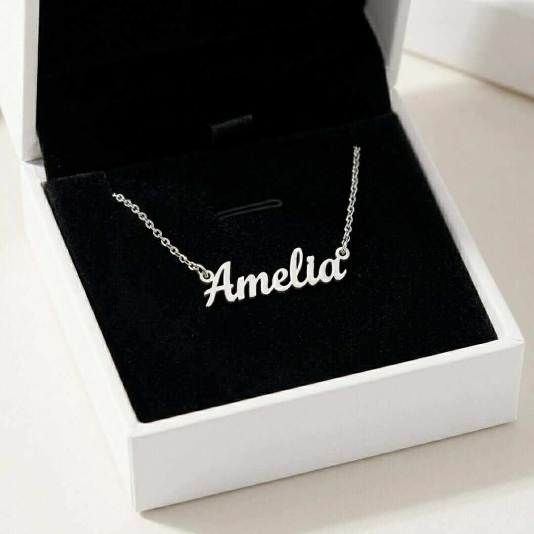 Signature Name Necklace featuring the name 'Amelia' displayed in a silver box with black velvet lining.