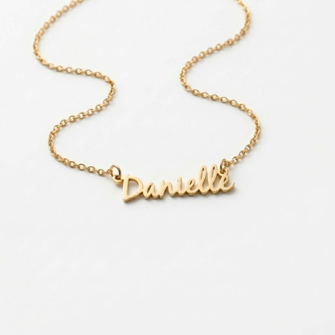 Signature Name Necklace in gold featuring the name Danielle, a custom jewelry piece perfect for personalized gifting.