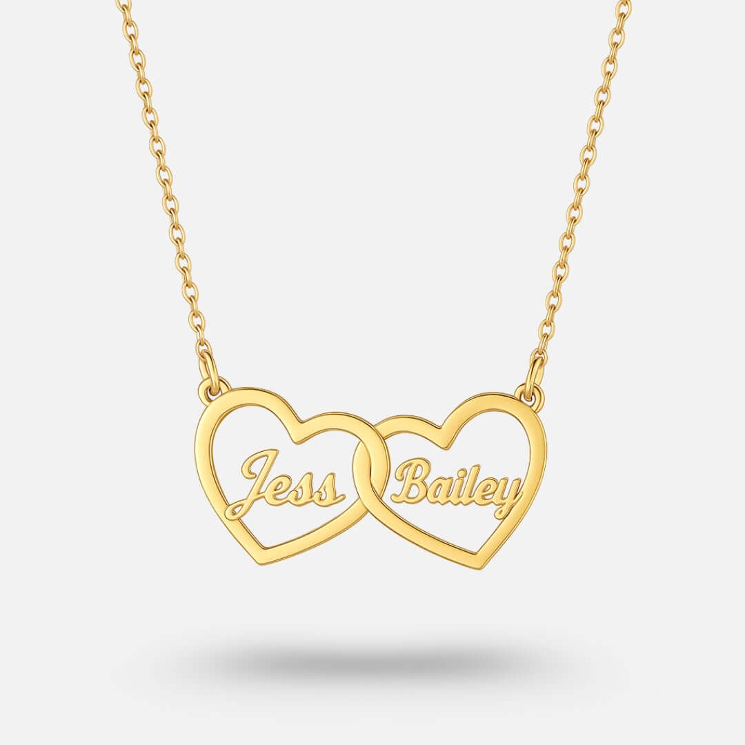 Two Hearts Necklace in gold with personalized engraving of names Tess and Bailey, representing love and bond.