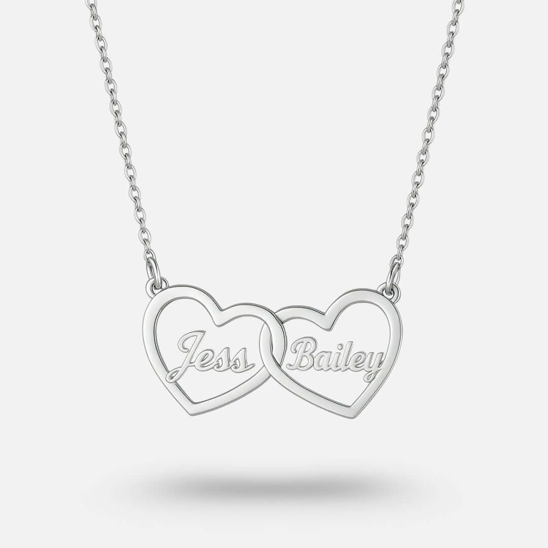 Two Hearts Necklace in silver, featuring personalized engraving of names Jess and Bailey, symbolizing love and bond.